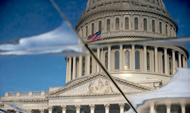 The Capitol Dome is seen reflected in water on Capitol Hill in Washington. (AP/Carolyn Kaster)