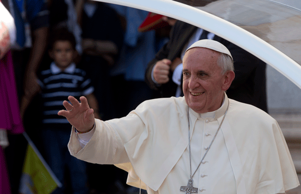 Pope Francis waves as he arrives at Cagliari's Cathedral, Italy, Sunday, September 22, 2013. (AP/Alessandra Tarantino)