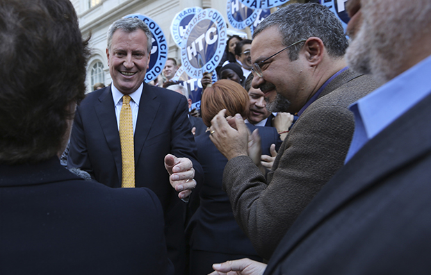 Democratic mayoral hopeful Bill de Blasio greets supporters after a news conference, Tuesday, September 17, 2013, on the steps of City Hall in New York. (AP/Mary Altaffer)