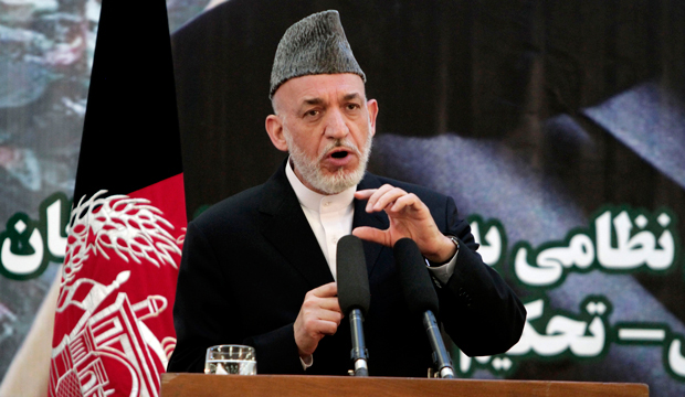 Afghan President Hamid Karzai speaks at a press conference during a ceremony at a military academy on the outskirts of Kabul, Afghanistan, Tuesday, June 18, 2013. (AP/Rahmat Gul)