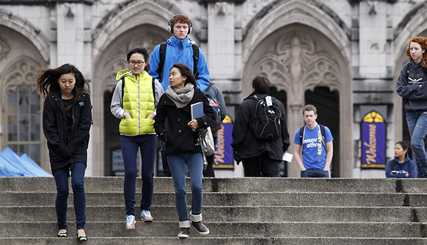 University of Washington students walk on the campus between classes. (AP/Elaine Thompson)
