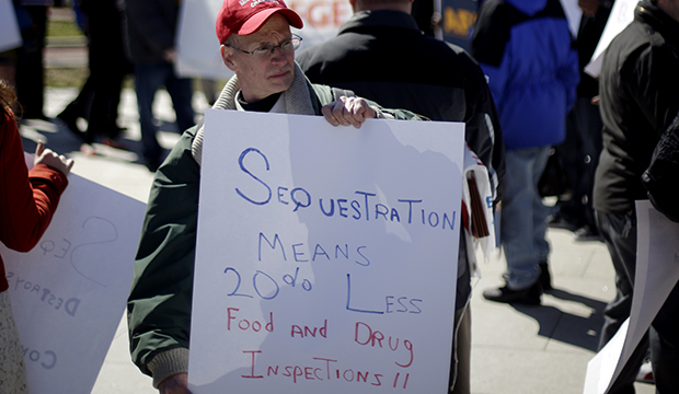 Government workers supporting union members and activists protest against the across-the-board federal spending cuts known as sequestration at Independence National Historical Park in Philadelphia. (AP/Matt Rourke)