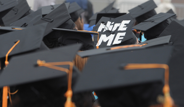 A cap worn by graduate Paul Szeto of Cambridge, Massachusetts, reads, 