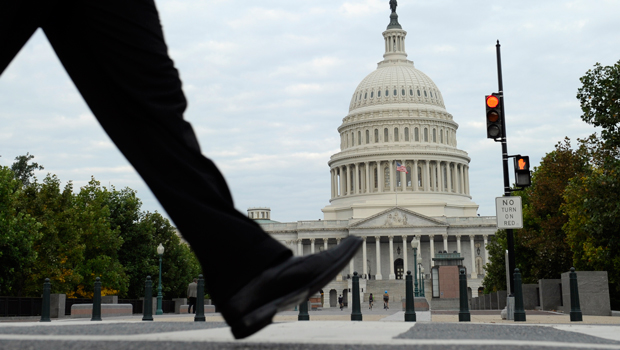 People walk near Capitol Hill in Washington, Tuesday, October 1, 2013. (AP/Susan Walsh)