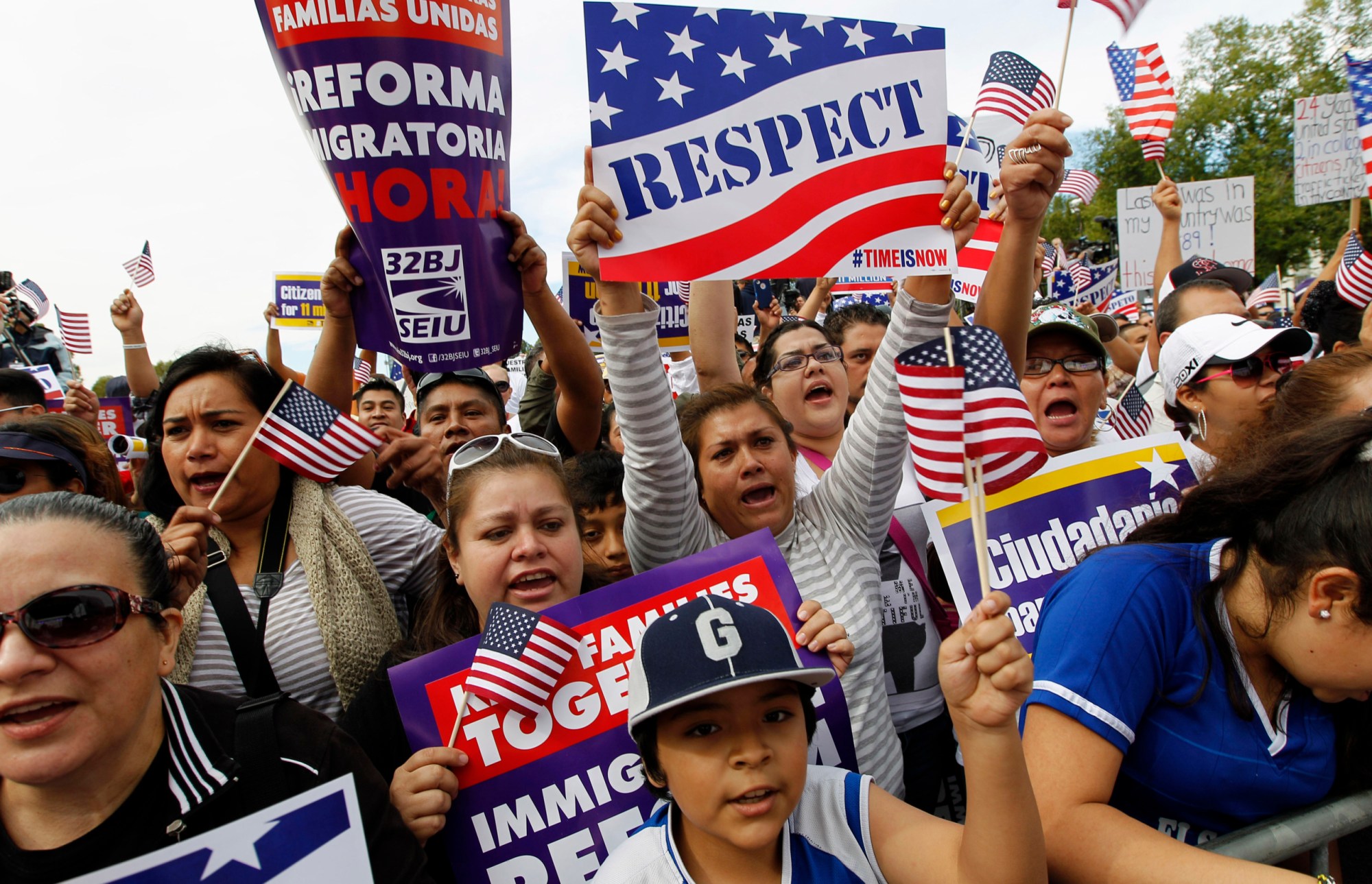 Demonstrators hold up their banners during an immigration rally on the National Mall on Tuesday, October 8, 2013, calling on the House of Representatives to pass comprehensive immigration reform with a path to citizenship. (AP/Jose Luis Magana)