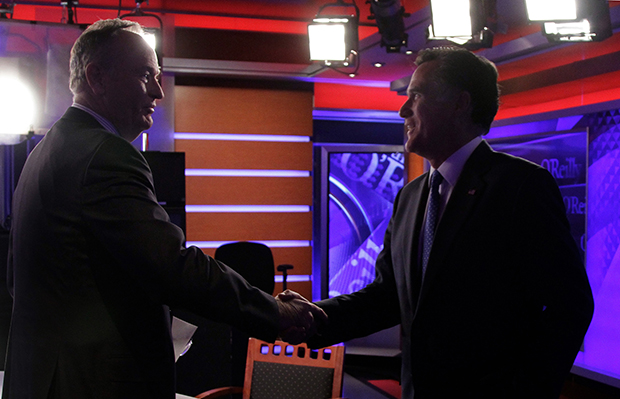 Former Republican presidential candidate Mitt Romney, right, shakes hands with Bill O'Reilly after his interview for O'Reilly's Fox News program 