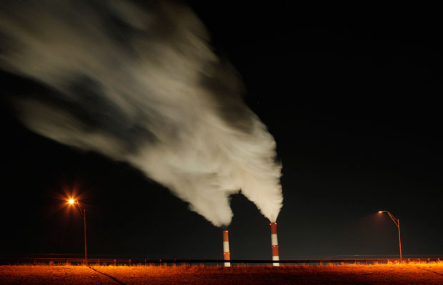 Smoke rises from the stacks of the La Cygne Generating Station coal-fired power plant in La Cygne, Kansas. (AP/Charlie Riedel)