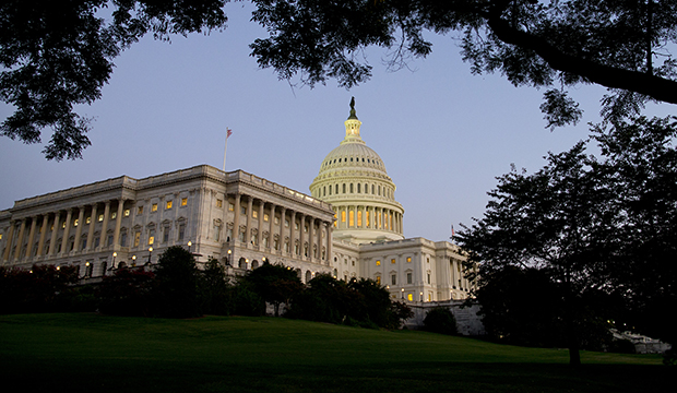 Dusk falls over the U.S. Capitol Building in Washington, Monday, September 30, 2013. (AP/Evan Vucci)