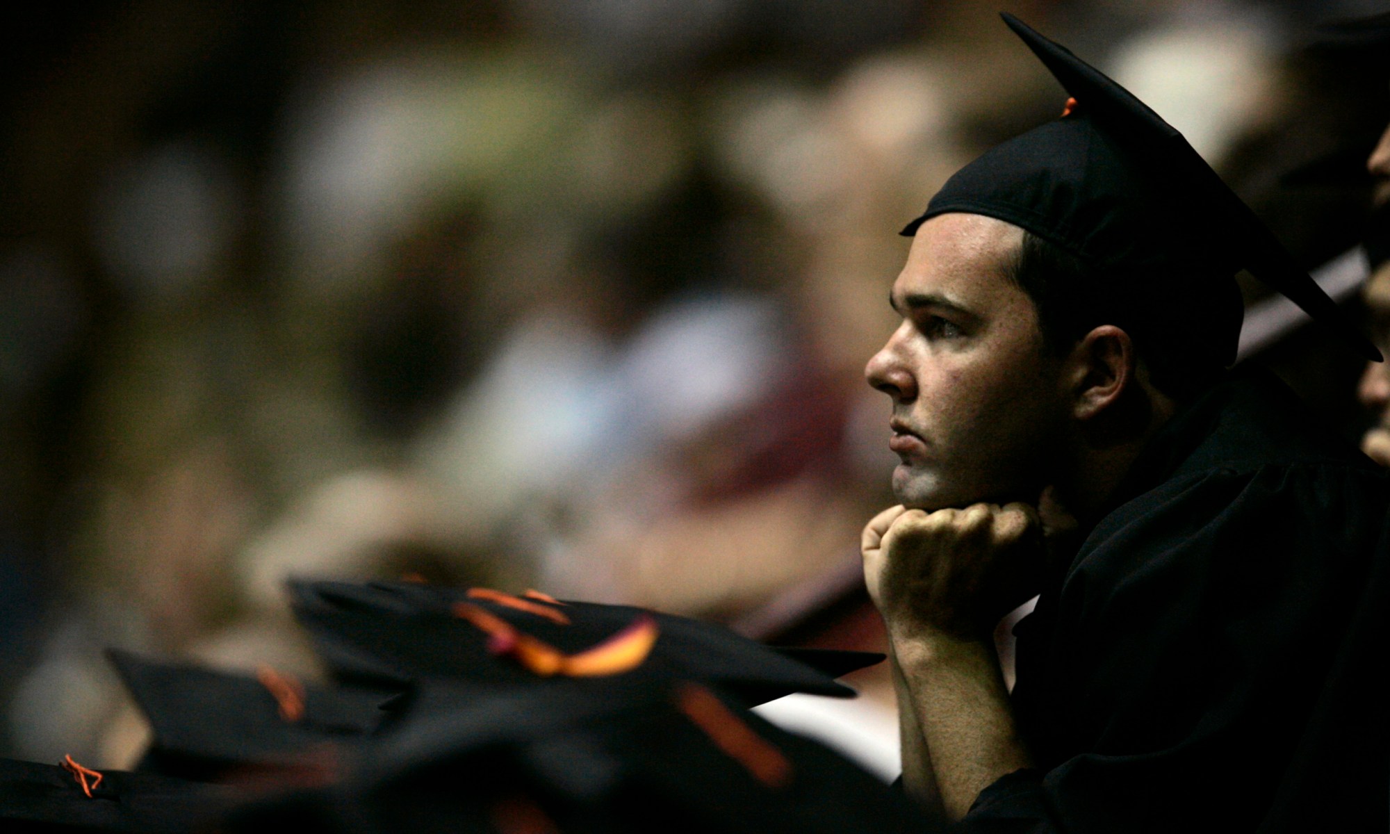 An undergraduate watches during an undergraduate College of Engineering graduation ceremony at Virginia Tech. (AP/Carolyn Kaster)