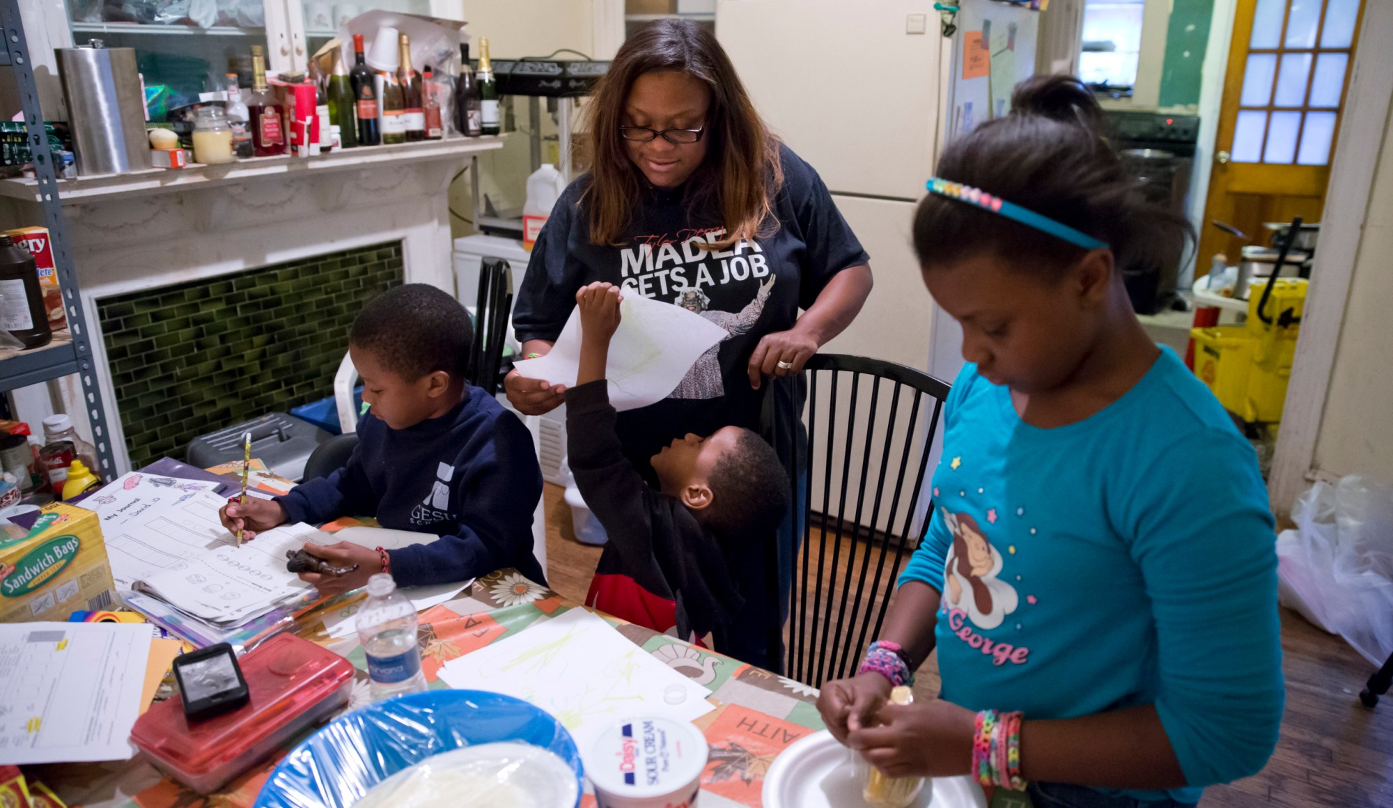 Jennifer Donald of Philadelphia and her three children are one of the many families that will be impacted by cuts to the Supplemental Nutrition Assistance Program. (AP/Matt Rourke)