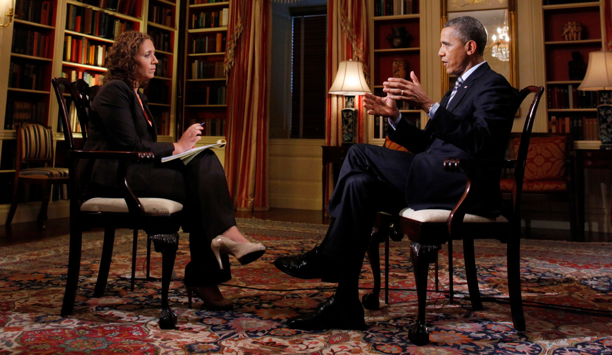 President Barack Obama speaks with a reporter during an interview in the White House library. (AP/Charles Dharapak)