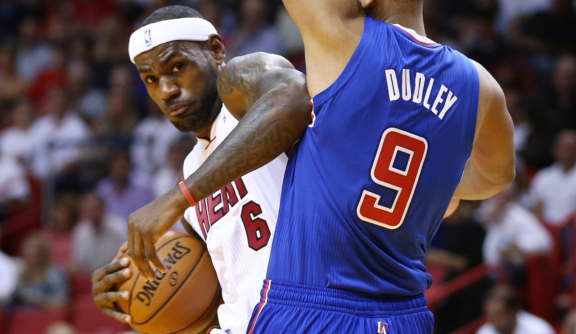 Miami Heat's LeBron James tries to get around Los Angeles Clippers' Jared Dudley during an NBA basketball game in Miami. (AP/J Pat Carter)