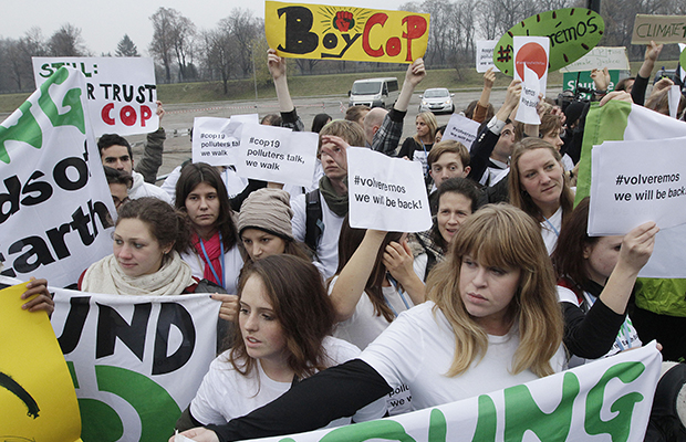 Members of civil-society movements walk out of the U.N. talks on global warming held at the National Stadium in Warsaw, Poland, on Thursday, November 21, 2013. They are impatient with the government negotiators, who, they believe, are making no progress toward the task of laying foundations for a new climate deal. (AP/Czarek Sokolowski)