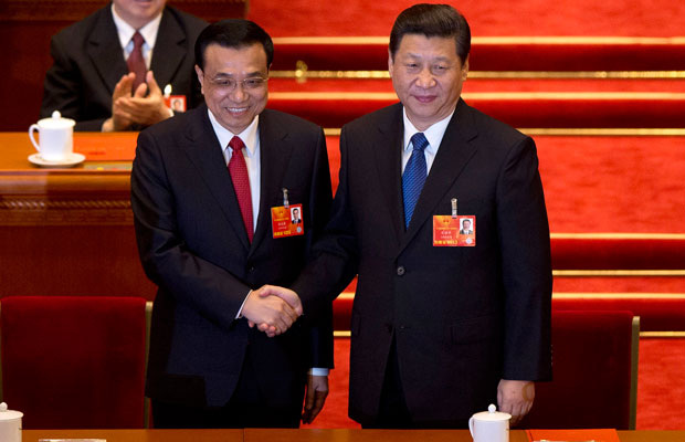 Chinese Premier Li Keqiang and Chinese President Xi Jinping shake hands in Beijing's Great Hall of the People. (AP/Alexander F. Yuan)
