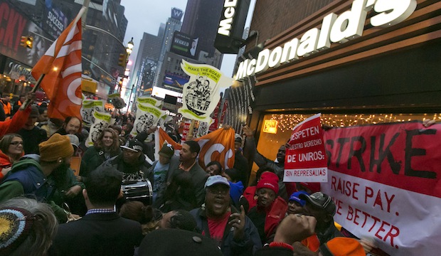 Demonstrators rally for better wages outside a McDonald's restaurant in New York, as part of a national protest, Thursday, December 5, 2013. (AP/Richard Drew)