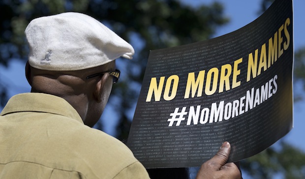 Carl Brooks of West Orange, New Jersey, who lost his nephew and brother-in-law in gun violence, attends a rally on gun control on Capitol Hill in Washington, Thursday, September 19, 2013. (AP/Manuel Balce Ceneta)