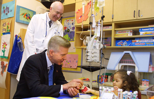 California Gov. Gray Davis (D) visits Mattel Children's Hospital. In 2002, Gov. Davis signed a bill allowing most California workers to take paid leave after the birth or adoption of a child or to care for sick family member. (AP/Lee Celano)