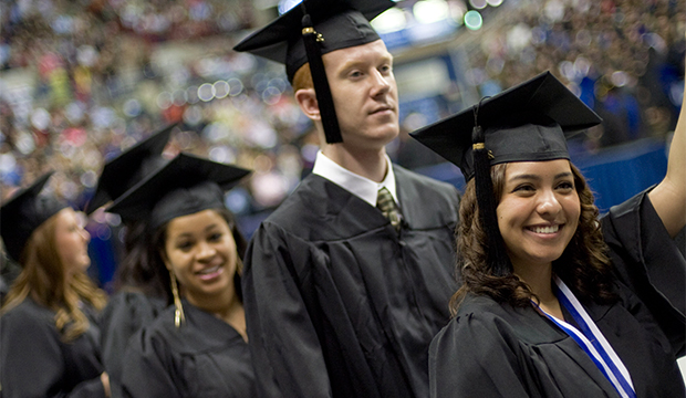 Diana Ramirez of Stonington waves to family during the University of Connecticut's commencement ceremony in Storrs, Connecticut, Sunday, May 6, 2012. (AP/Jessica Hill)