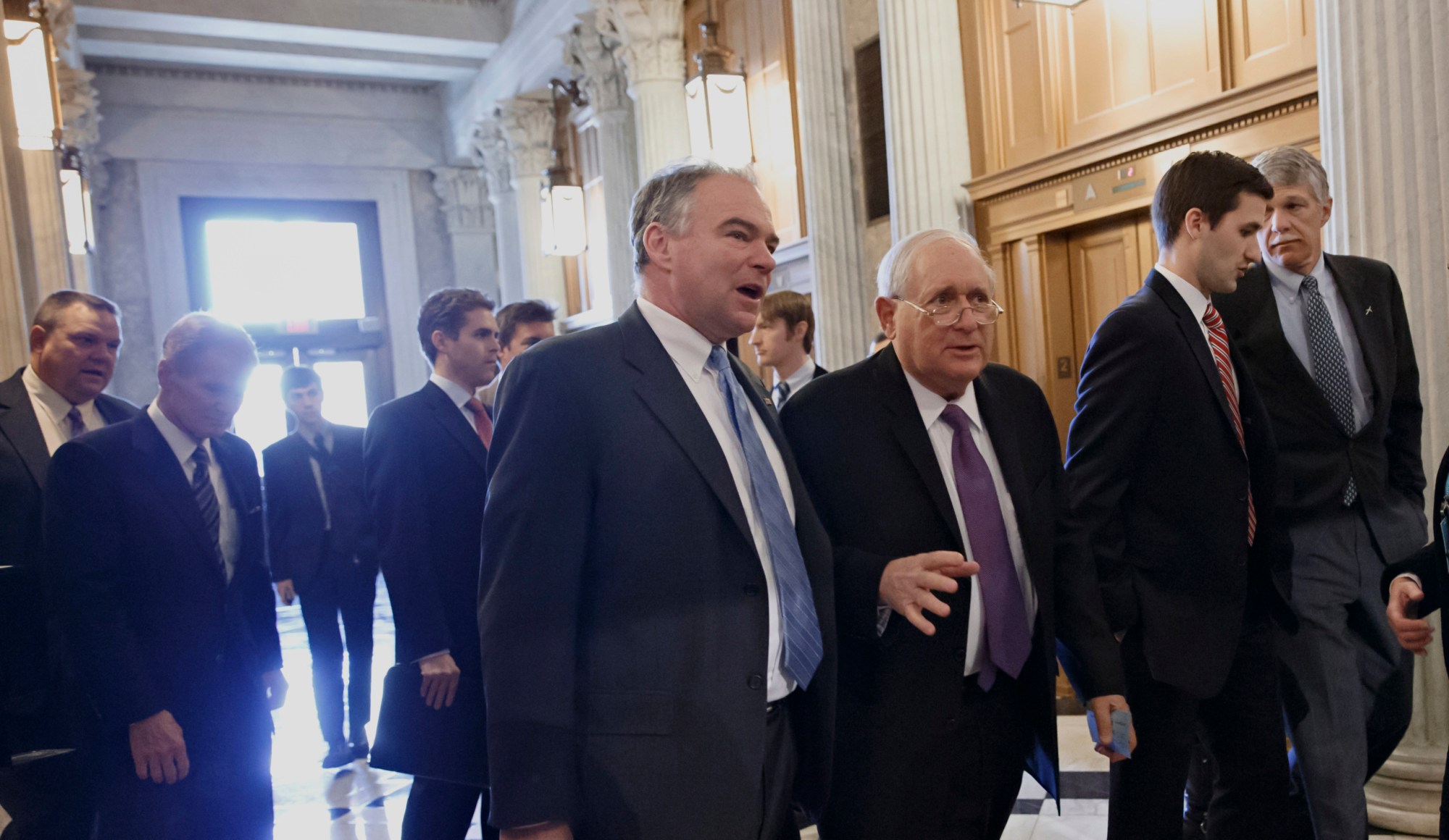 Sen. Tim Kaine (D-VA) and Sen. Carl Levin (D-MI) walk to the Senate chamber for a procedural vote on legislation to renew long-term unemployment benefits. (AP/J. Scott Applewhite)