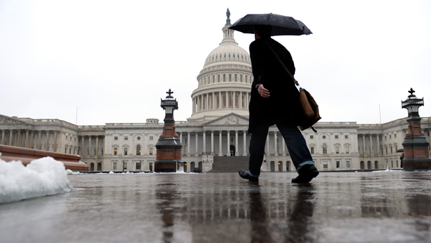 A person walks on Capitol Hill in Washington, Monday, December 9, 2013. (AP/Susan Walsh)