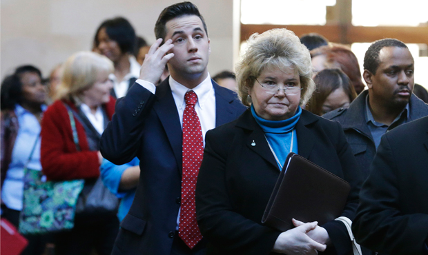 Job seekers line up to meet prospective employers during a career fair at a hotel in Dallas on Wednesday, January 22, 2014. (AP/LM Otero)