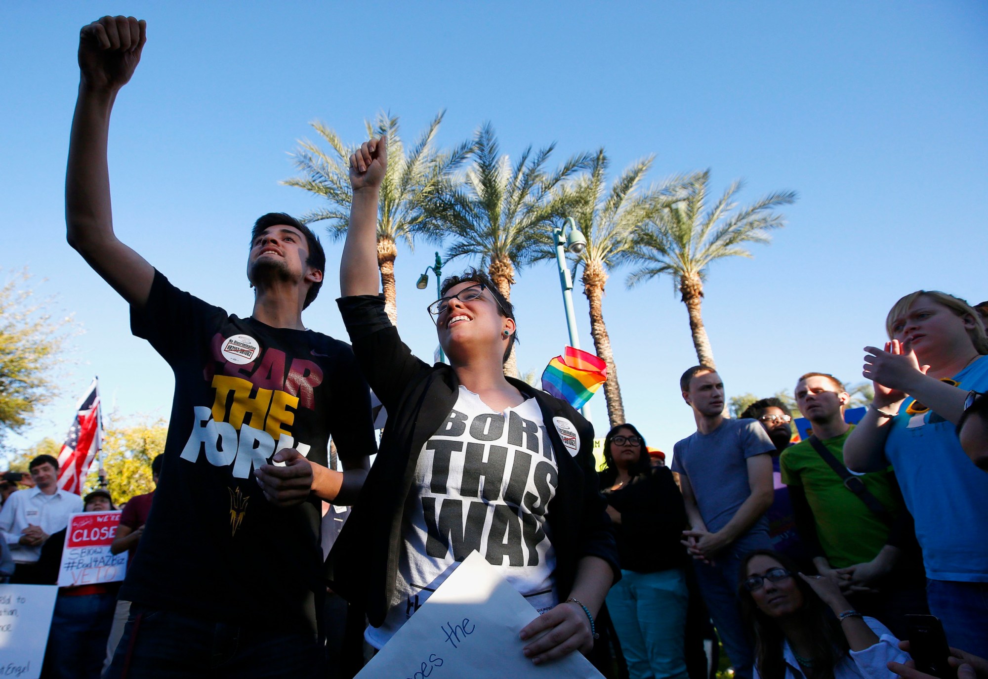 Anthony Musa and Brianna Pantillione joined nearly 250 LGBT rights supporters who protested S.B. 1062 at the Arizona State Capitol. (AP/Ross D. Franklin)