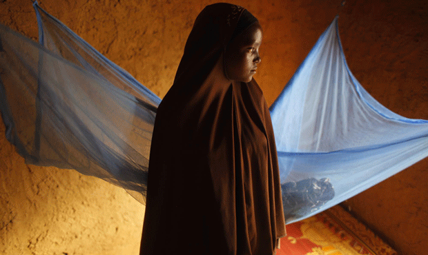 In this picture taken Wednesday, July 18, 2012, Zali Idy, 12, poses in her bedroom in the remote village of Hawkantaki, Niger. Zali was married in 2011. (AP/Jerome Delay)