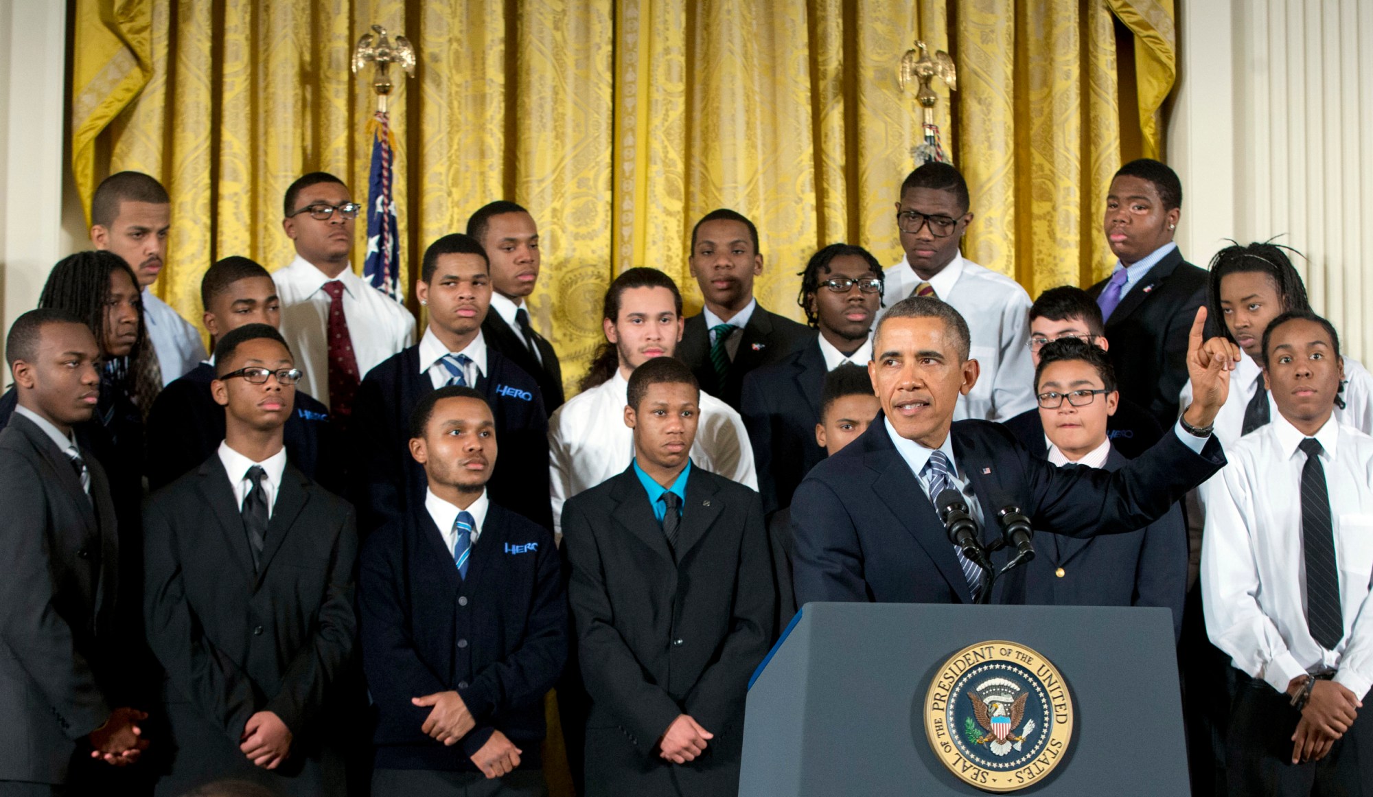 Joined at the White House by young men of color, President Barack Obama promotes his 