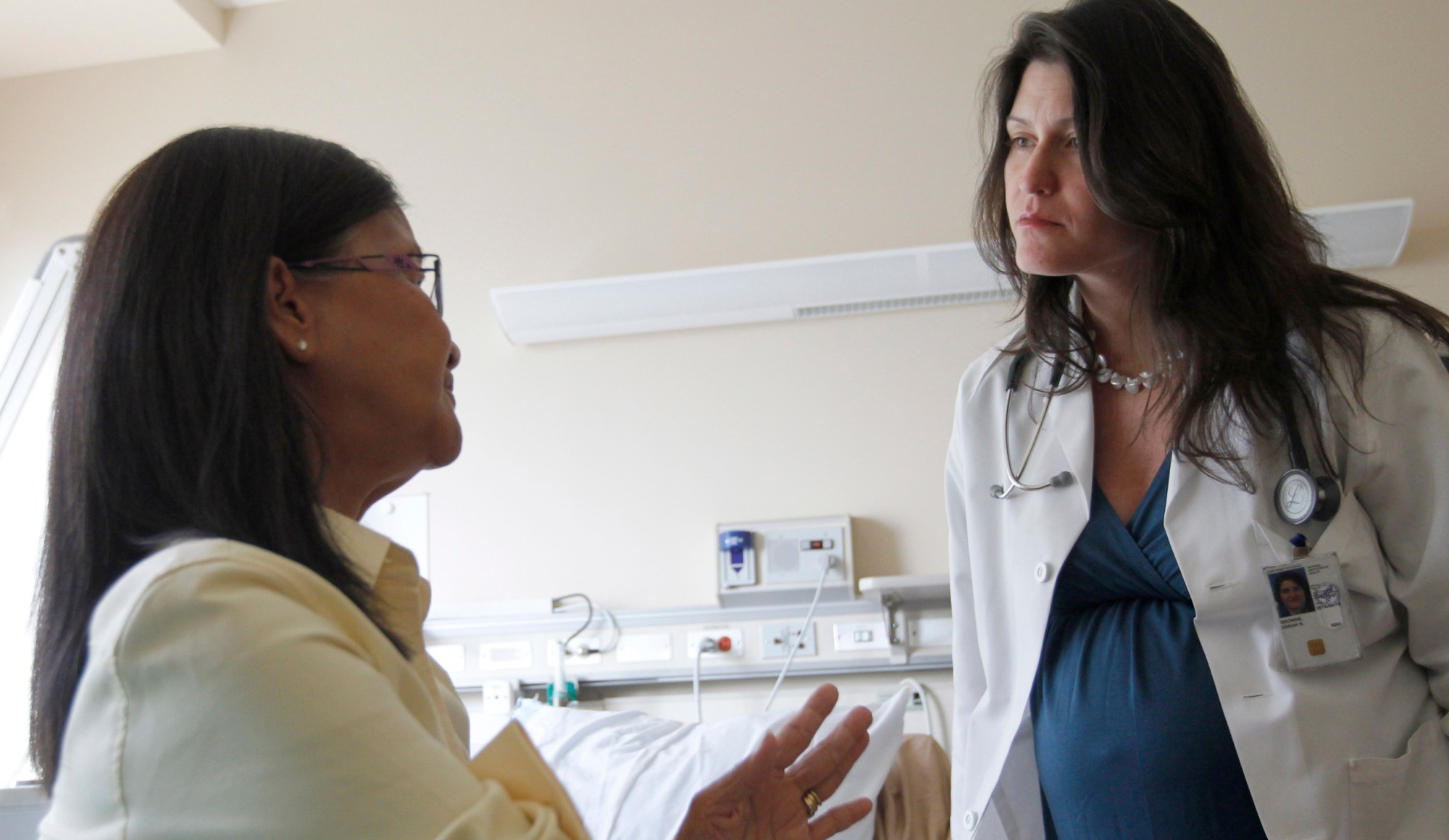 Dr. Sarah K. Browne talks with patient Kim Nguyen at the National Institutes of Health in Bethesda, Maryland. (AP/Pablo Martinez Monsivais)