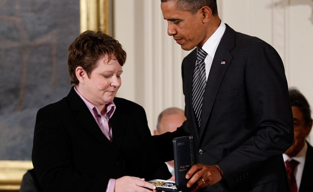 President Barack Obama awards the 2011 Presidential Citizens Medal to Janice Langbehn during a White House ceremony. Langbehn fought for hospital visitation rights for same-sex couples. (AP/Charles Dharapak)