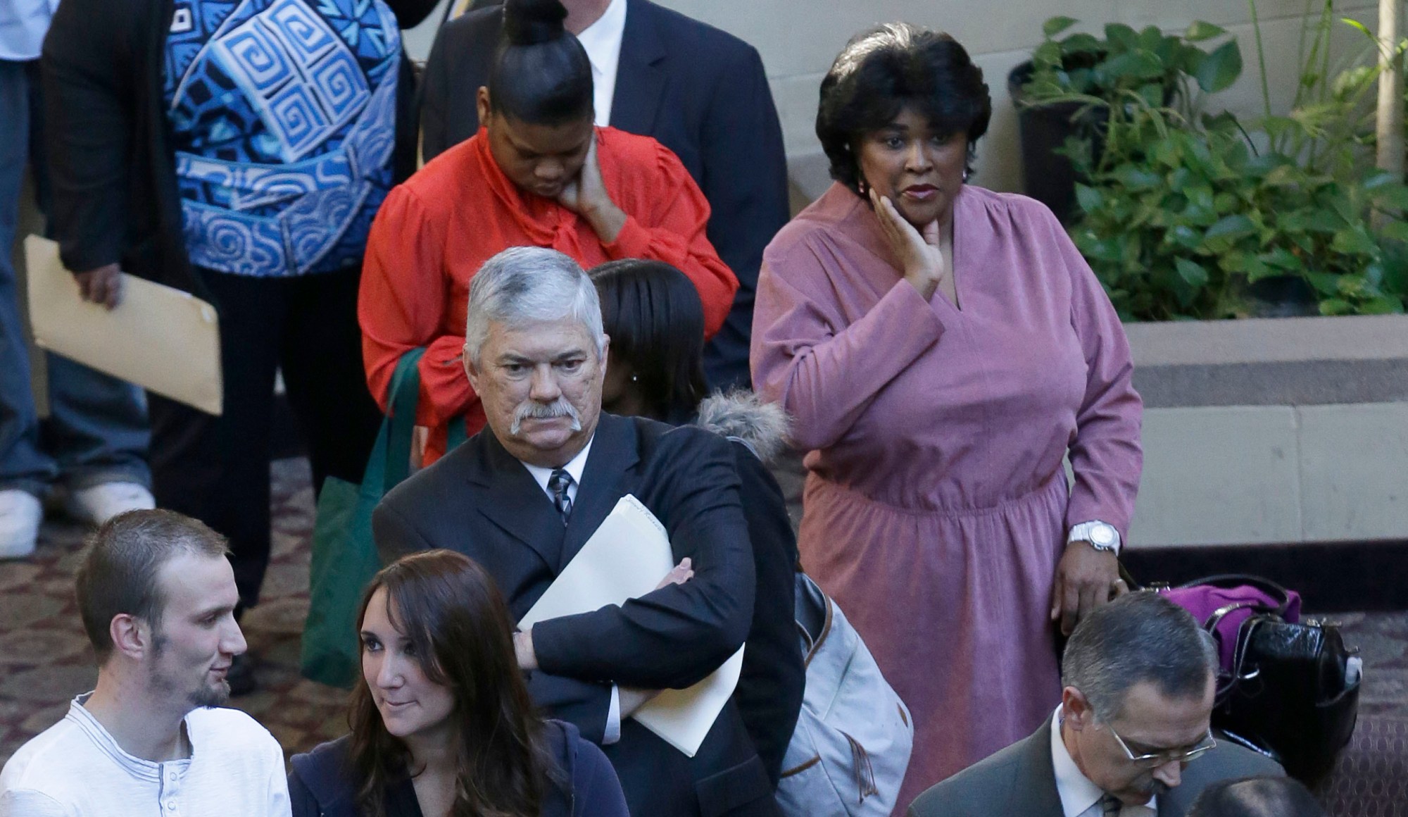 Job seekers line up to meet prospective employers at a career fair in Dallas. (AP/LM Otero)