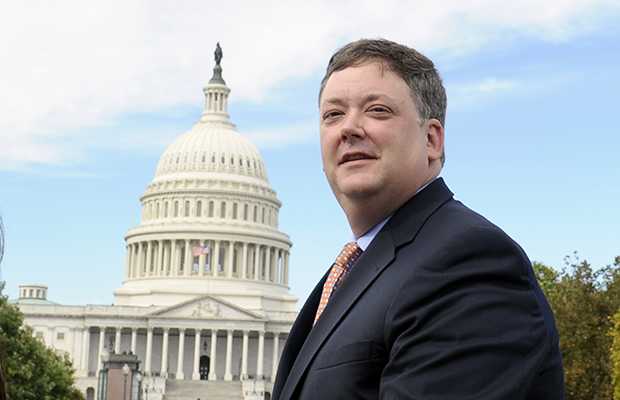 Republican activist Shaun McCutcheon of Hoover, Alabama, walks past the Capitol as he leaves the Supreme Court in Washington, October 8, 2013, after the court's hearing on campaign finance. (AP/Susan Walsh)