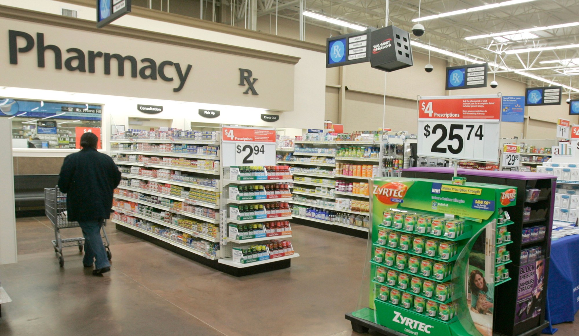 A shopper walks toward the pharmacy at a Little Rock, AK Wal-Mart store. (AP/Danny Johnston)