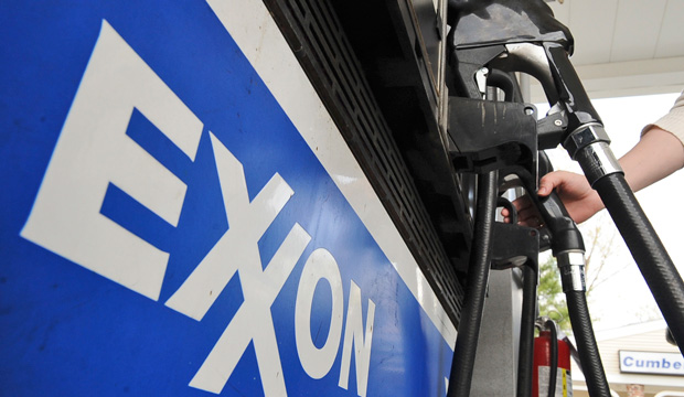 A customer pumps gas at an Exxon station in Middleton, Massachusetts. (AP/Lisa Poole)