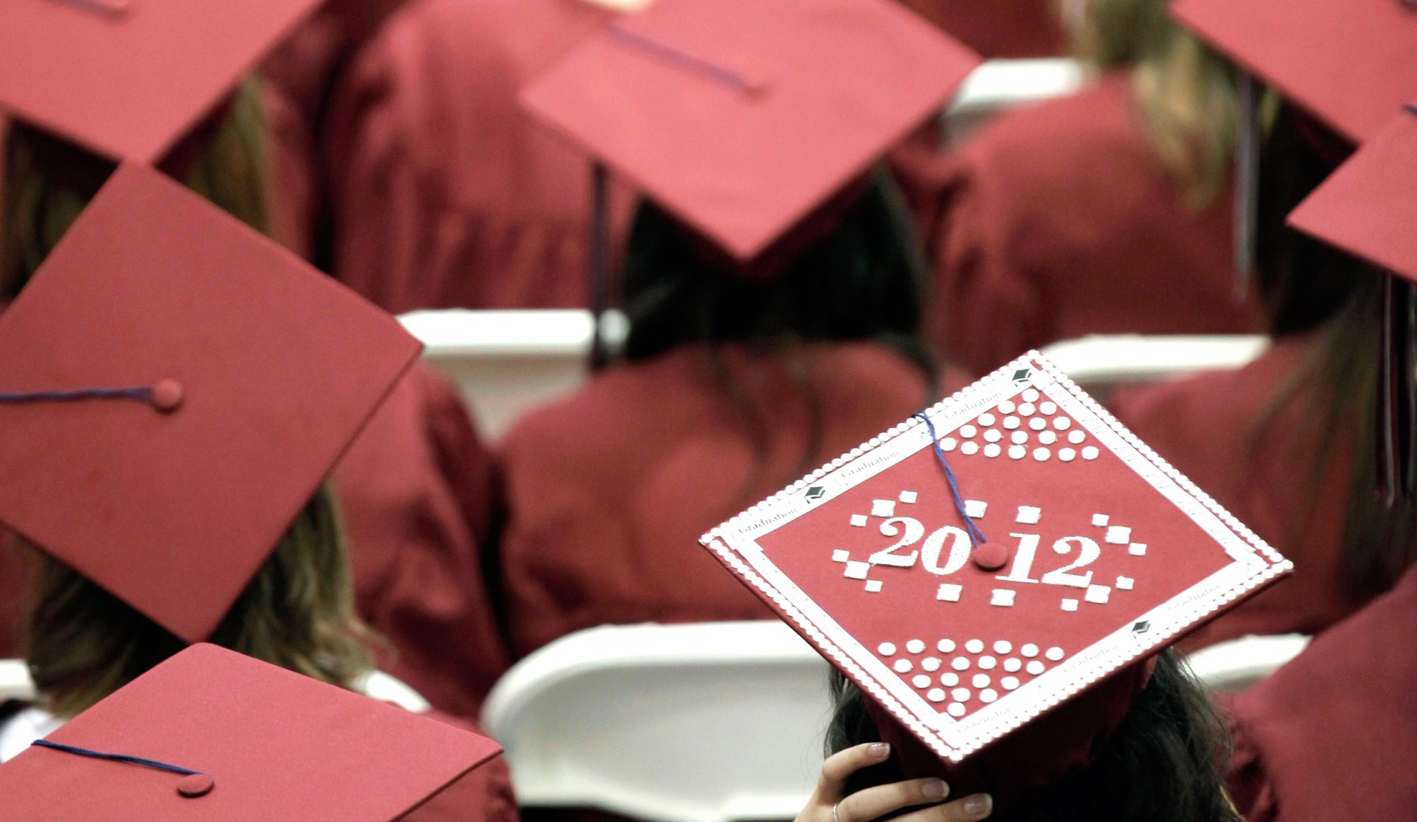 Graduates from Joplin High School listen to speakers during commencement ceremonies in Joplin, MO in May 2012. (AP/Charlie Riedel)