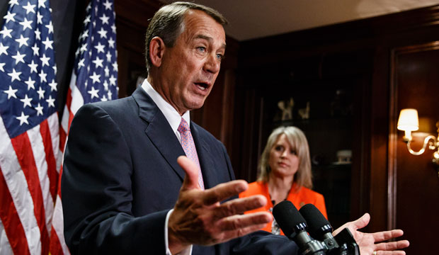 House Speaker John Boehner of Ohio, joined by Rep. Renee Ellmers (R-NC), talks to reporters following a Republican strategy meeting on Capitol Hill. (AP Photo)