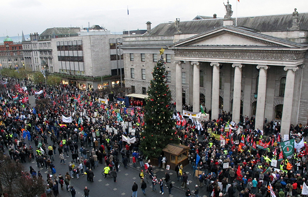 Thousands of anti-austerity protesters rally outside Dublin's General Post Office to hear speeches opposing government plans for more spending cuts and tax increases, Saturday, November 24, 2012. (AP/Shawn Pogatchnik)