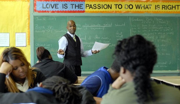 L.E. Rabouin High School teacher Norman Smith teaches language arts to students at the Louisiana Recovery School District school in New Orleans. (AP Photo/Cheryl Gerber)