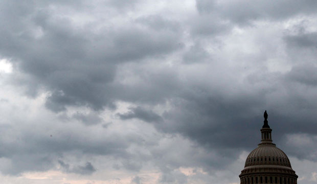 Dark clouds surround the Capitol dome on Capitol Hill. (AP/Alex Brandon)