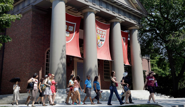 Prospective students are led on a tour of a college campus. (AP/Elise Amendola)