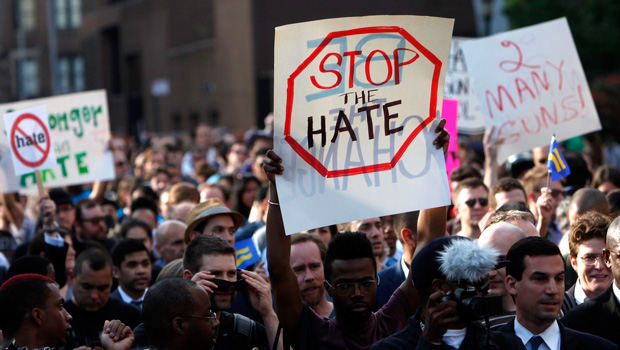 Members of the LGBT community and their supporters gather to speak out after a string of hate violence during a rally in New York's Greenwich Village, Monday, May 20, 2013. (AP/Jason DeCrow)