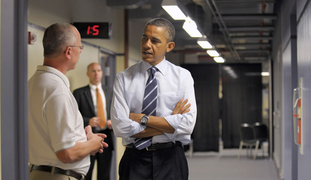 President Barack Obama talks with electrical apprenticeship instructor Tim Wisyanski during a visit to the International Brotherhood of Electrical Workers, or IBEW, Local No. 5 Training Center in Pittsburgh, Pennsylvania. (AP/Susan Walsh)