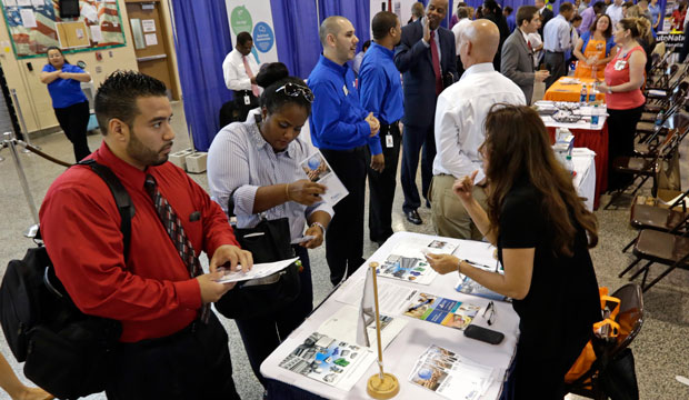 Job seekers check out the job opportunities at a hiring fair in Fort Lauderdale, Florida. (AP/Alan Diaz)