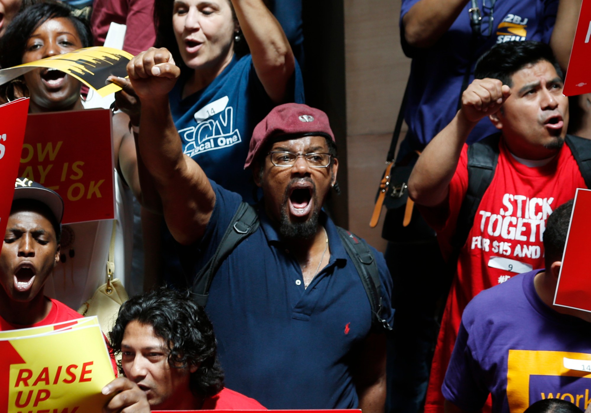 People rally for an increase in the minimum wage in Albany, New York. (AP/Mike Groll)