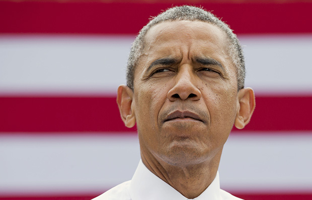 President Barack Obama pauses while speaking about the economy at the Turner-Fairbank Highway Research Center in McLean, Virginia, Tuesday, July 15, 2014. (AP/Jacquelyn Martin)