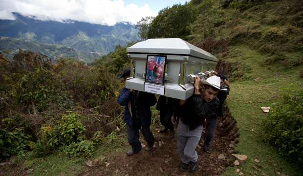 Relatives carry to a local cemetery the coffin containing the remains of Gilberto Francisco Ramos Juarez, a Guatemalan boy whose decomposed body was found in the Rio Grande Valley, July 2014. (AP/ Moises Castillo)