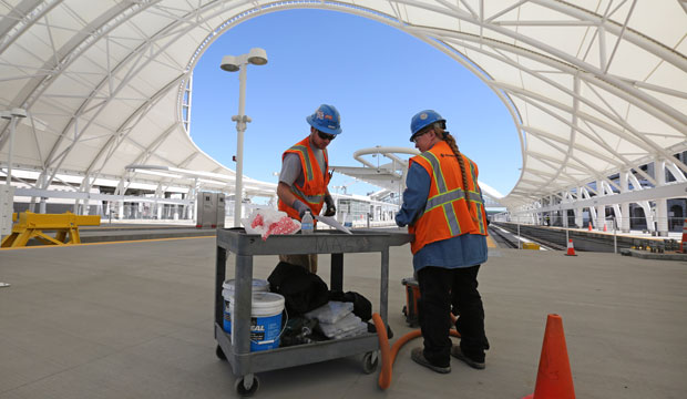 Construction workers prep wire for installing in Denver, Colorado. In April, the Associated General Contractors of America announced a plan to deal with the shortage of construction workers, which includes establishing apprenticeship programs. (AP/Brennan Linsley)