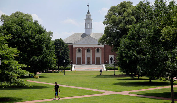 People walk on Johns Hopkins University's Homewood campus in Baltimore. Johns Hopkins is under investigation for its handling of an alleged rape, July 2014. (AP/Patrick Semansky)