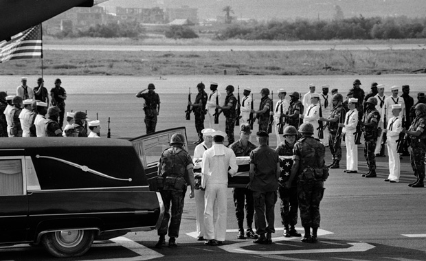 U.S. Marine and Navy pallbearers remove the coffin of one of the American staffers killed in the U.S. Embassy bomb blast in Beirut from a hearse on April 23, 1983. (AP/Zuheir Saade)