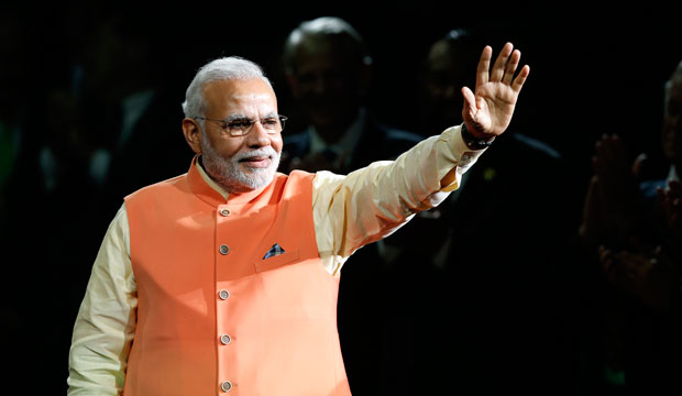 Indian Prime Minister Narendra Modi waves to the crowd as he arrives to give a speech at Madison Square Garden on September 28, 2014. (AP/Jason DeCrow)